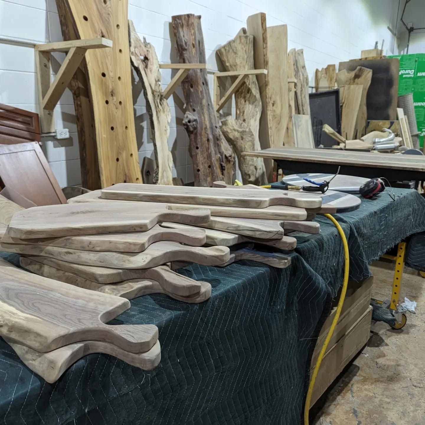 Batch of custom wood charcuterie boards in progress at Calgary Wood Works shop