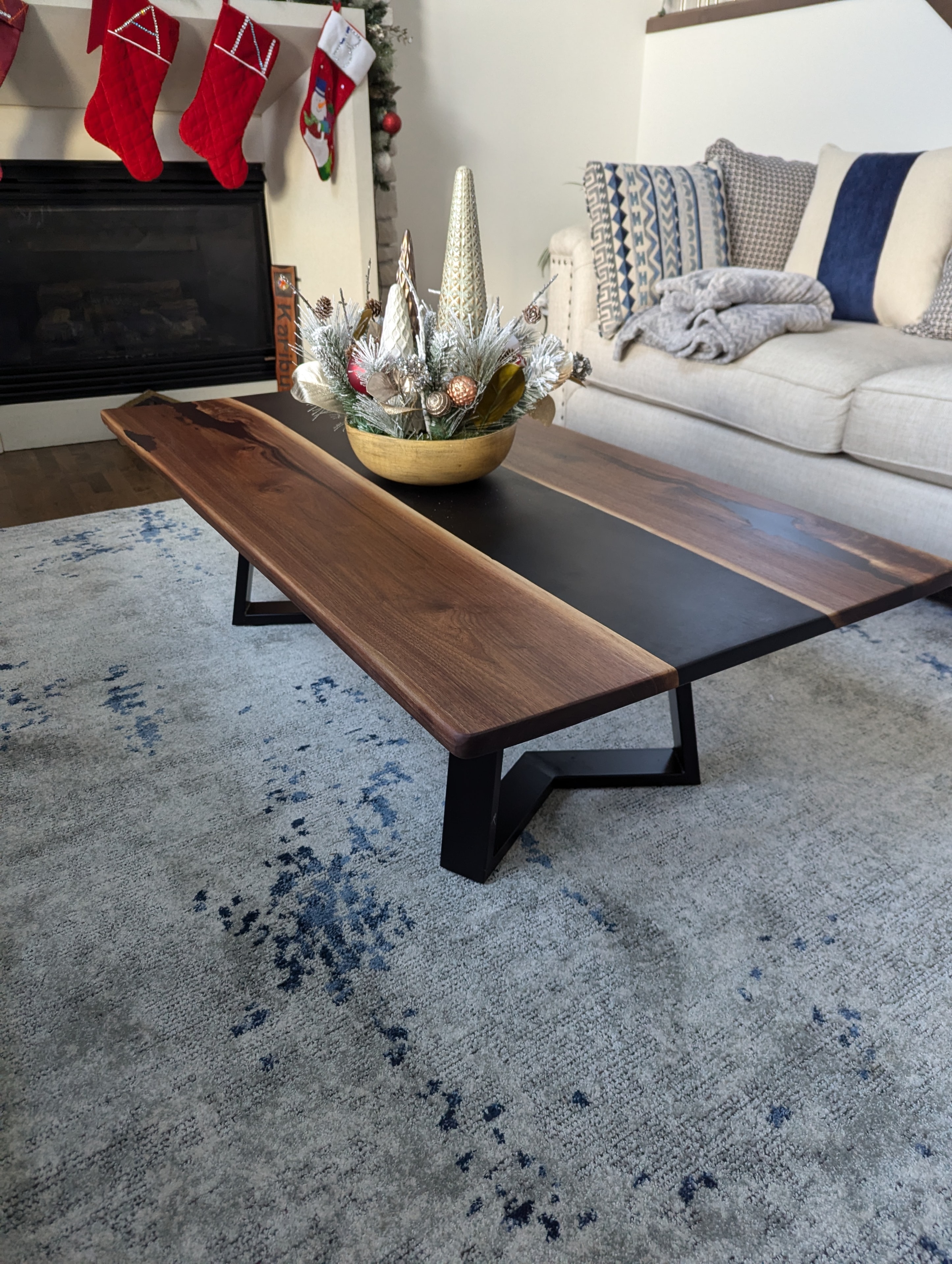Live edge walnut black epoxy river coffee table with Z-base — shop display
