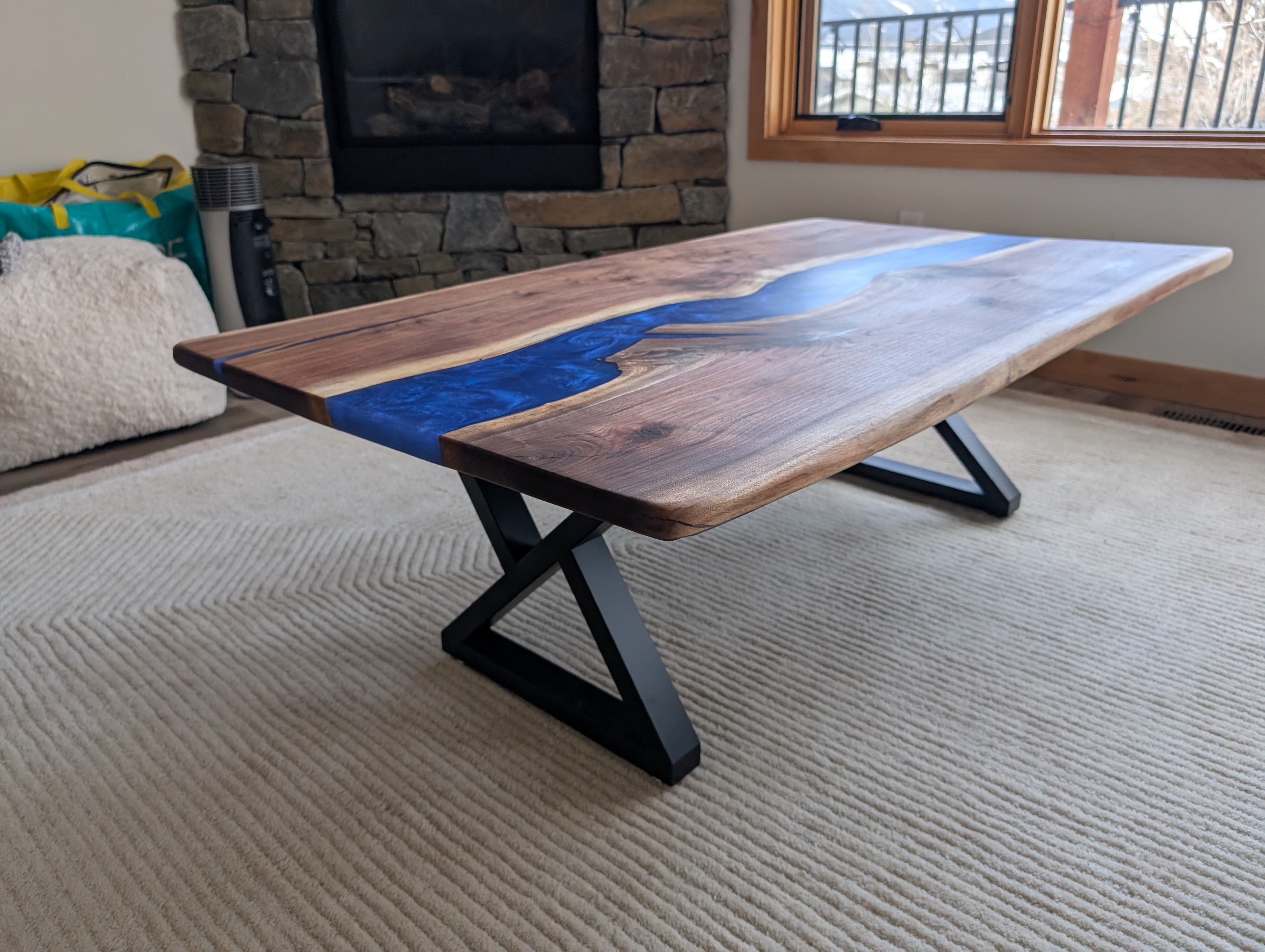 Live edge walnut black epoxy river coffee table — finished piece ready for delivery