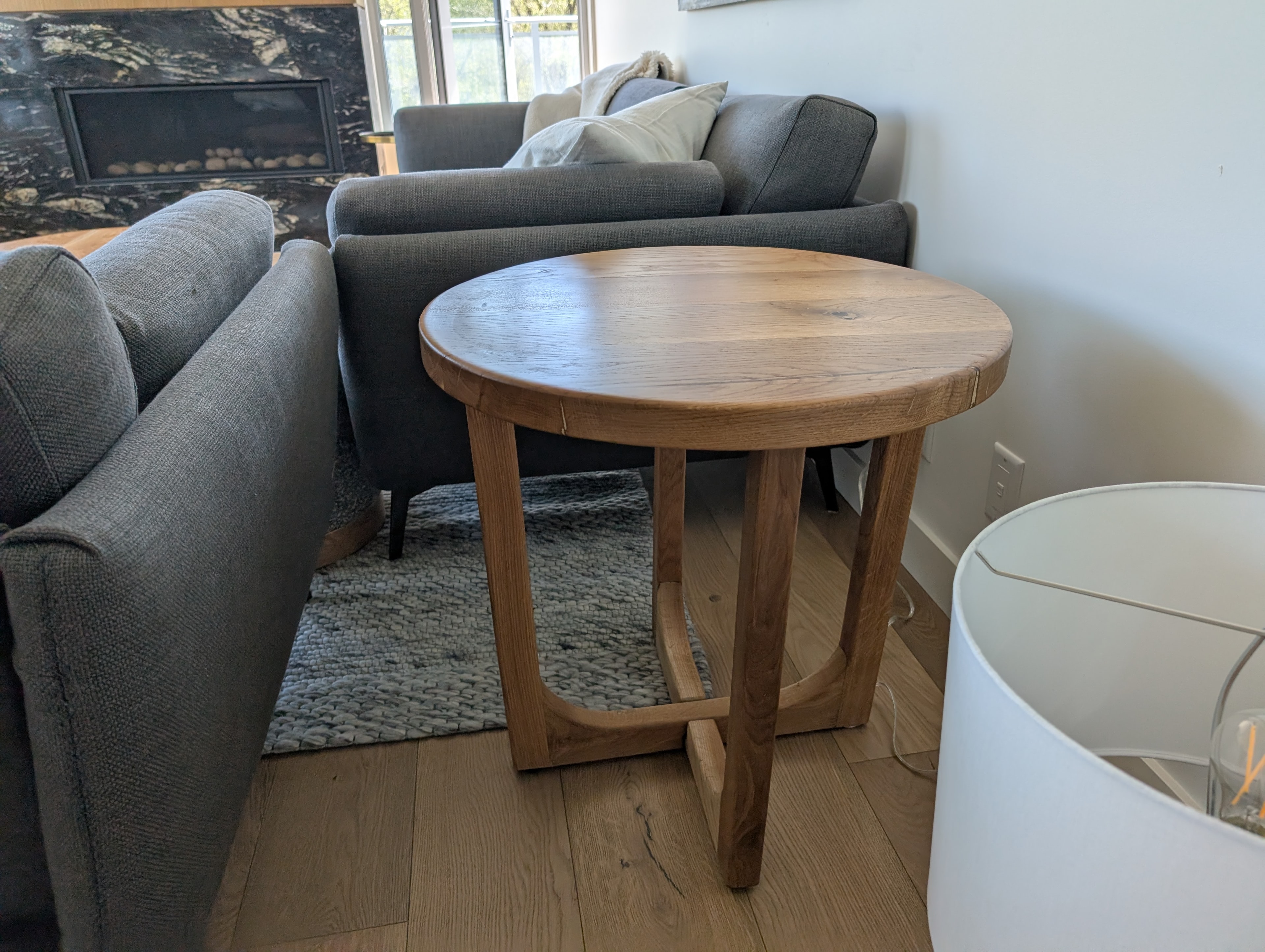 Round walnut black epoxy coffee table — detail view