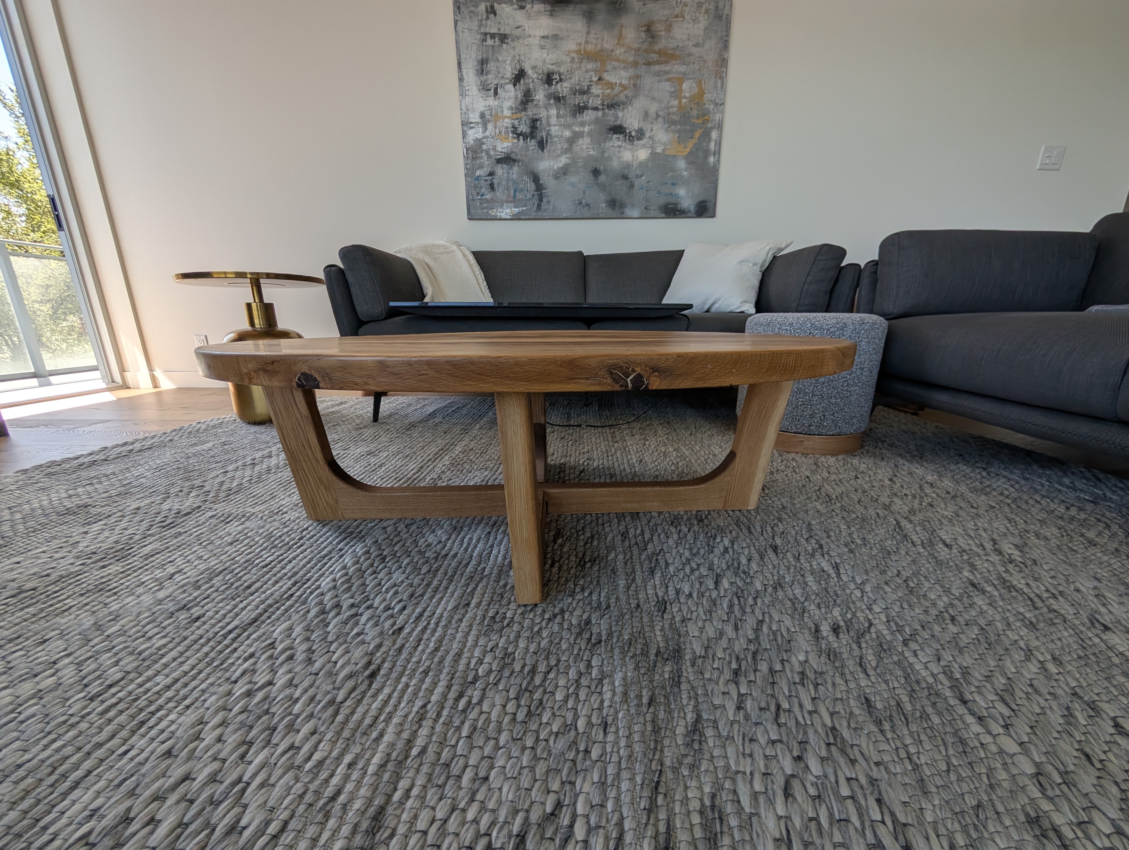 Round walnut black epoxy coffee table — finished piece in shop