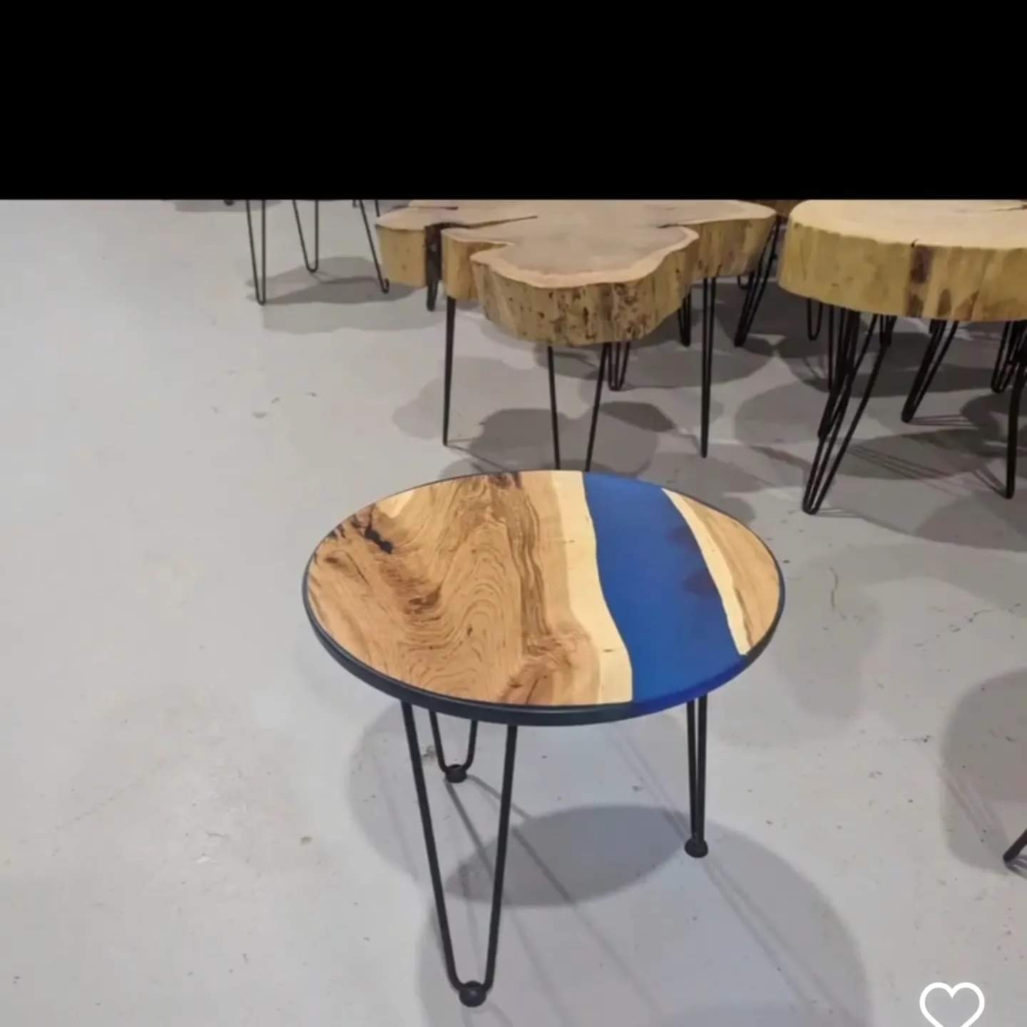 Round live edge coffee table with blue epoxy and hairpin legs