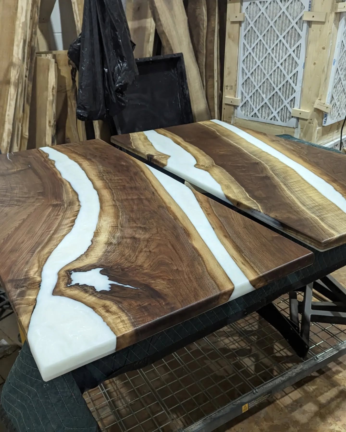 Matching pair of live edge walnut coffee tables with white epoxy triple river inlay — Calgary Wood Works shop