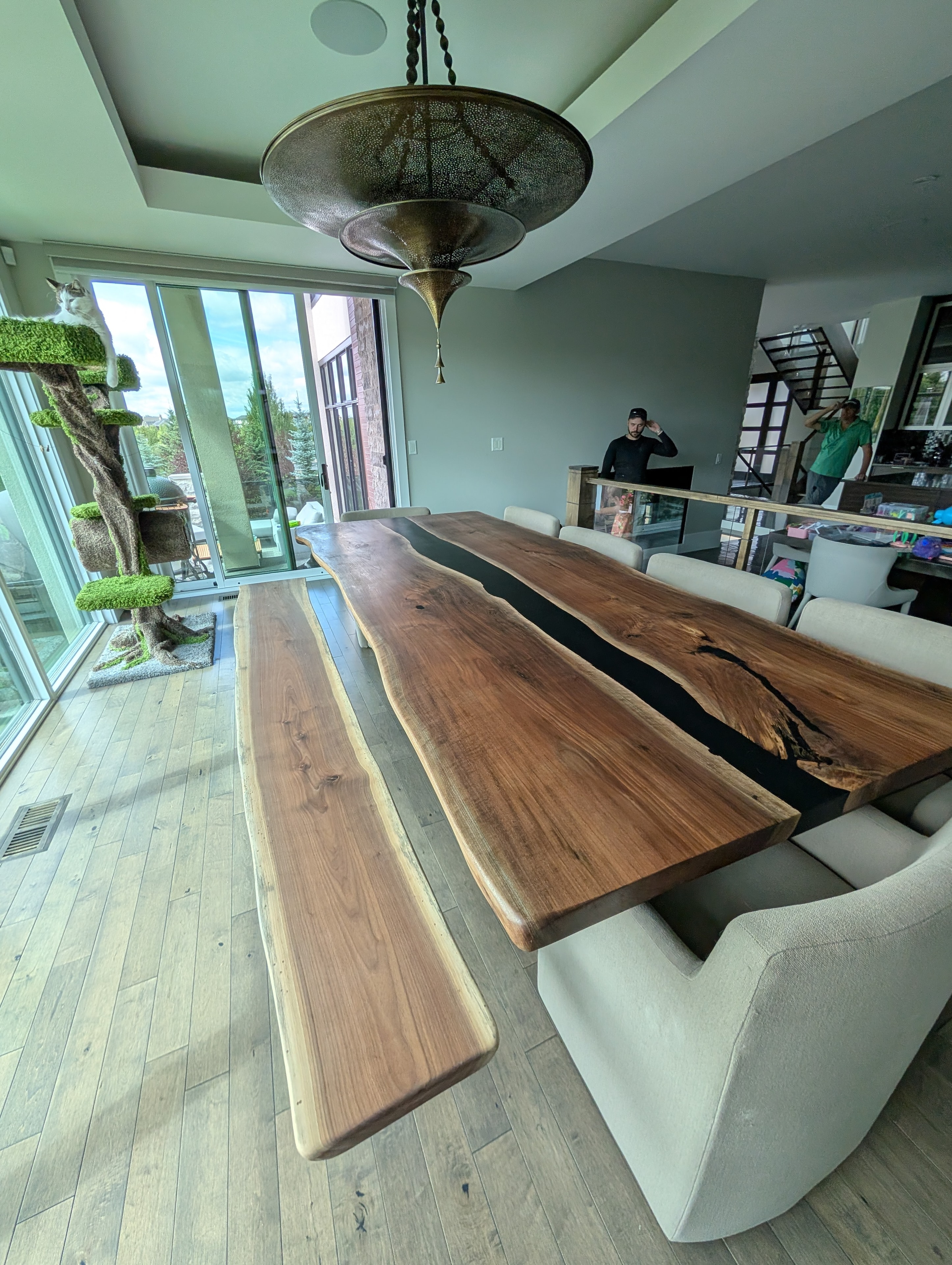 Live edge walnut black epoxy river dining table with matching bench