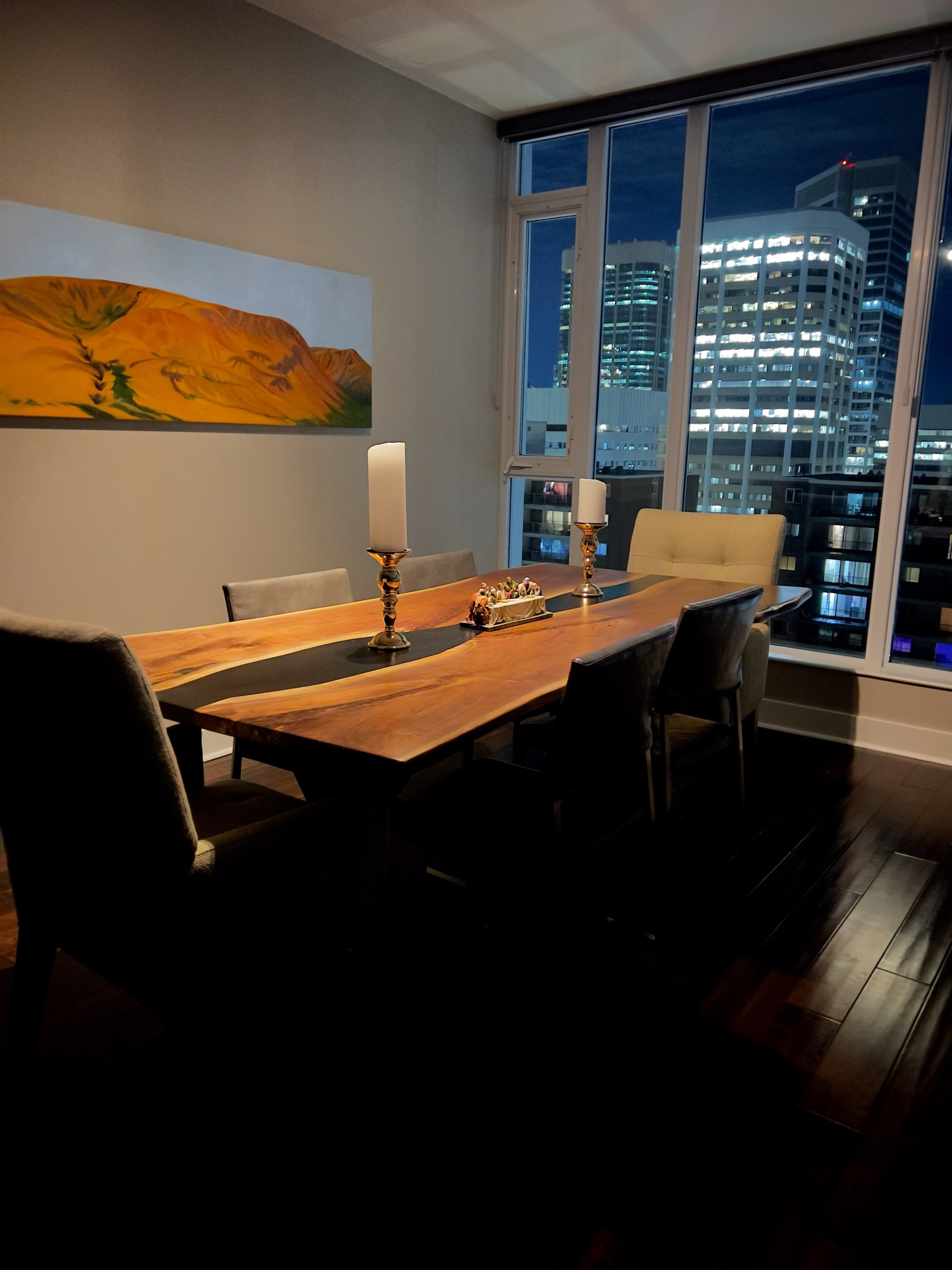 Black epoxy walnut dining table in Calgary highrise