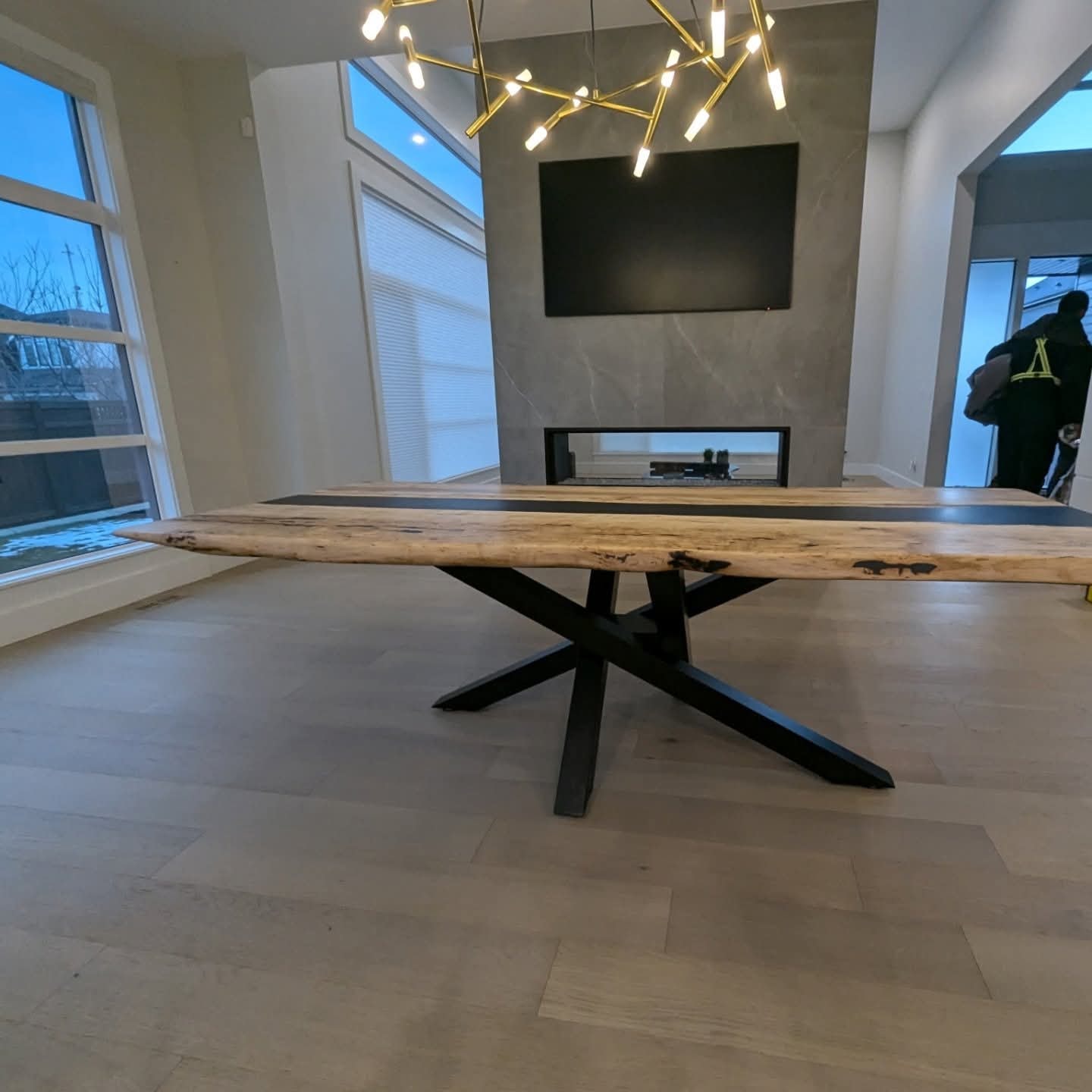 Live edge walnut black epoxy river dining table with grey velvet studded chairs