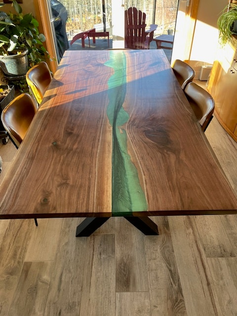 Green epoxy walnut dining table in sunroom — Calgary