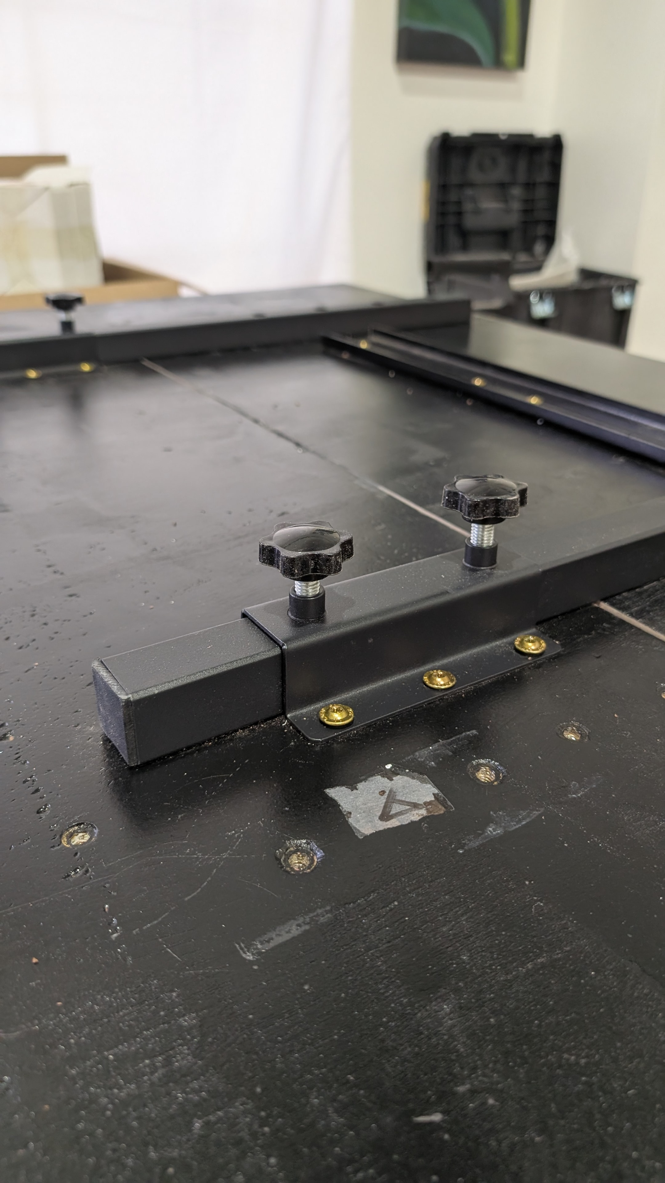 Precision steel extension mechanism closeup — custom expandable dining table hardware by Calgary Wood Works