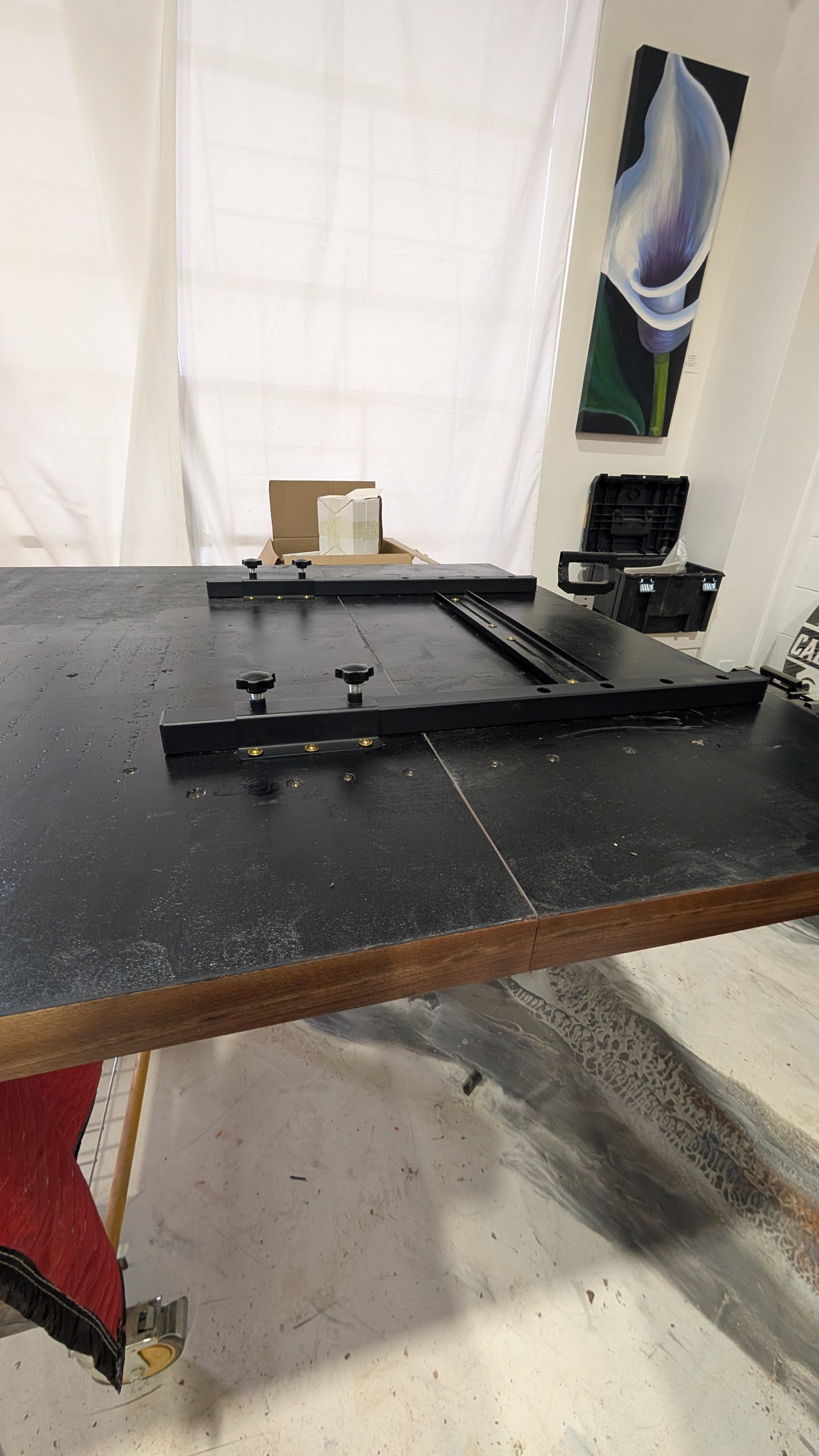 Steel extension slide mechanism on custom expandable dining table — Calgary Wood Works shop