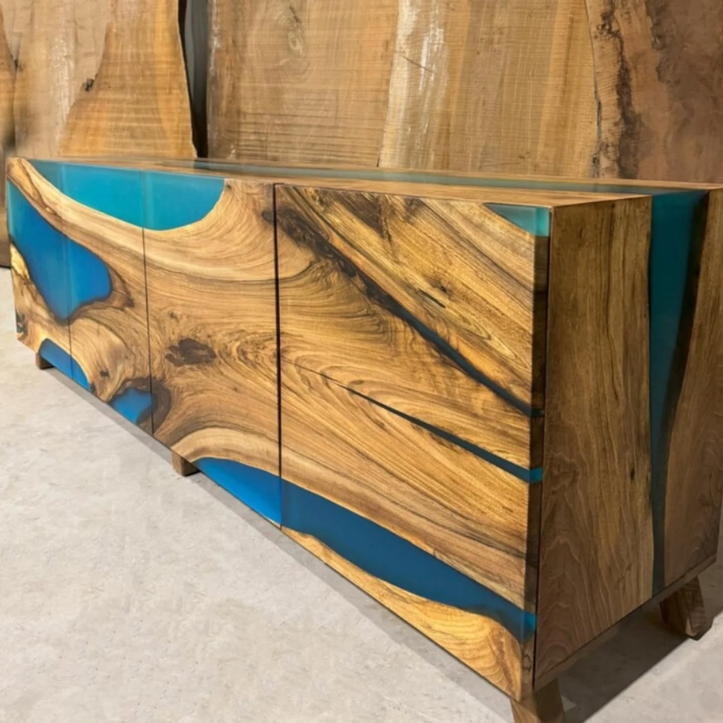 Walnut and teal epoxy credenza side angle view — custom Calgary furniture