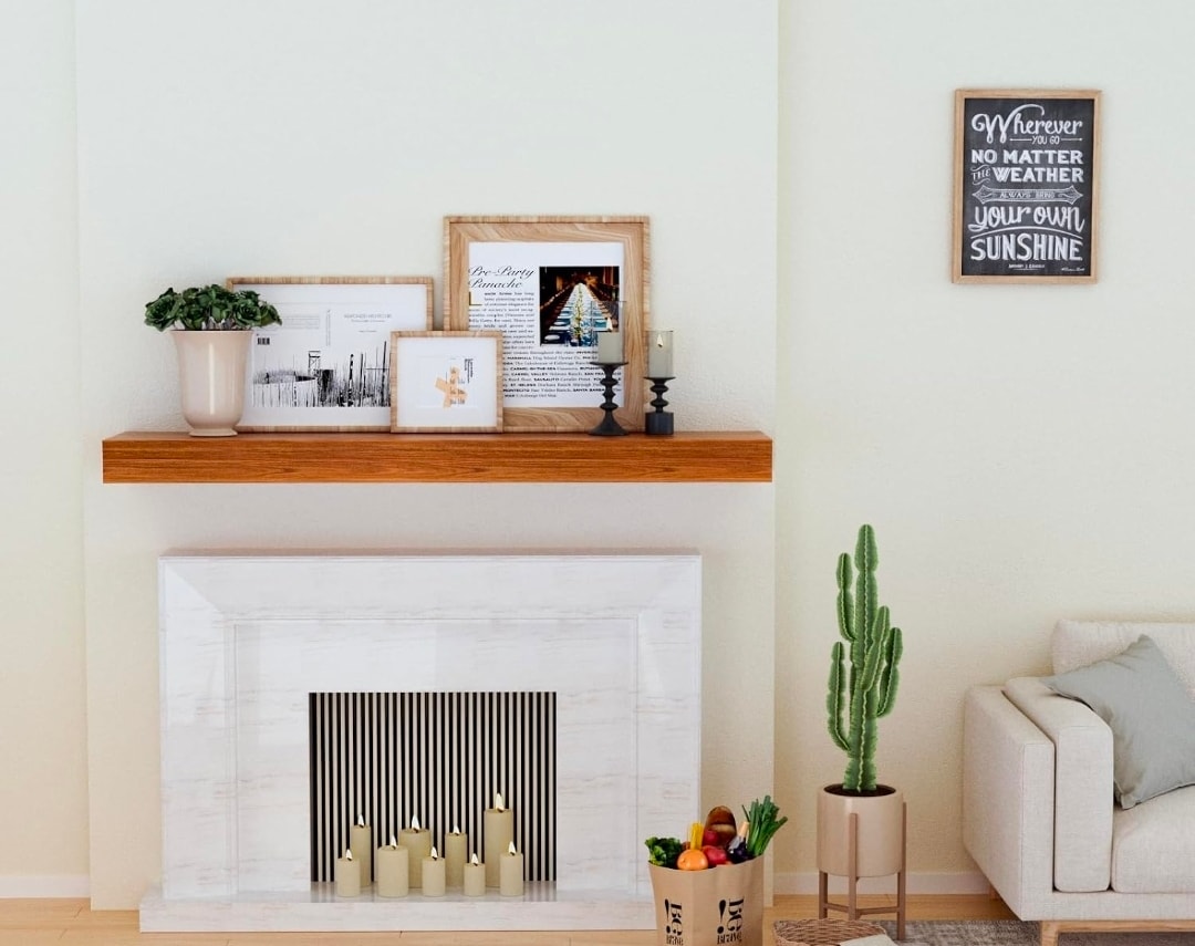 Walnut floating shelf styled above fireplace mantel with framed art and greenery — Calgary Wood Works