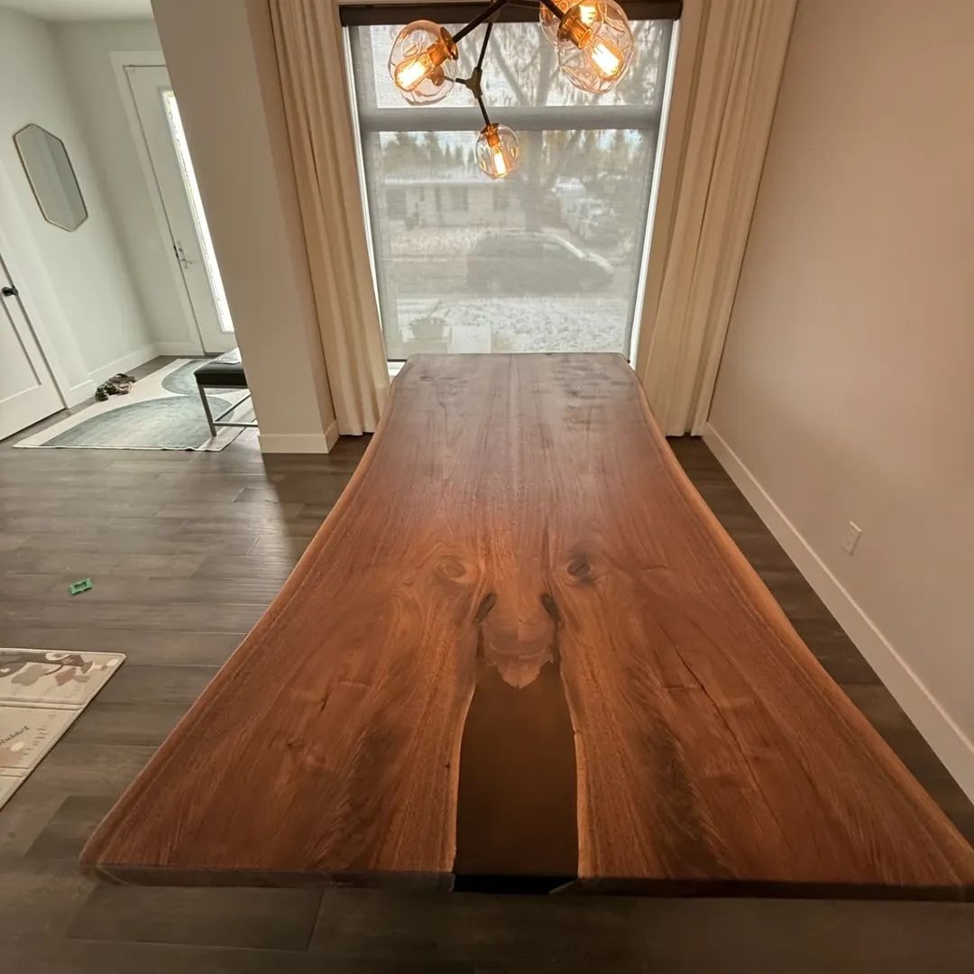 Live edge walnut dining table with pendant light — Calgary